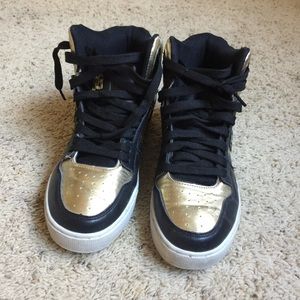 Black and gold sneakers